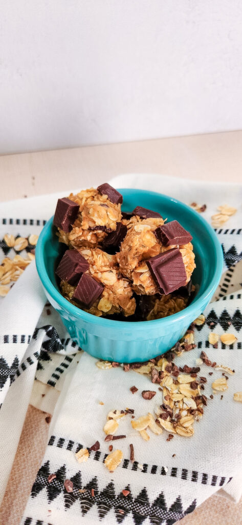 hemp heart chocolate balls topped with chocolate chunks inside a blue bowl